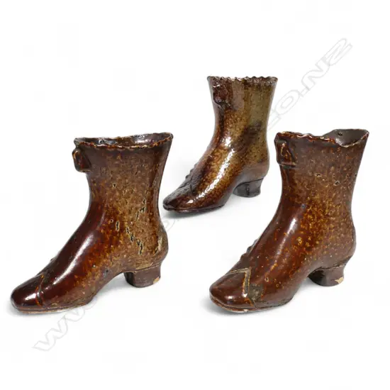 Three early New Zealand pottery ladies boots,