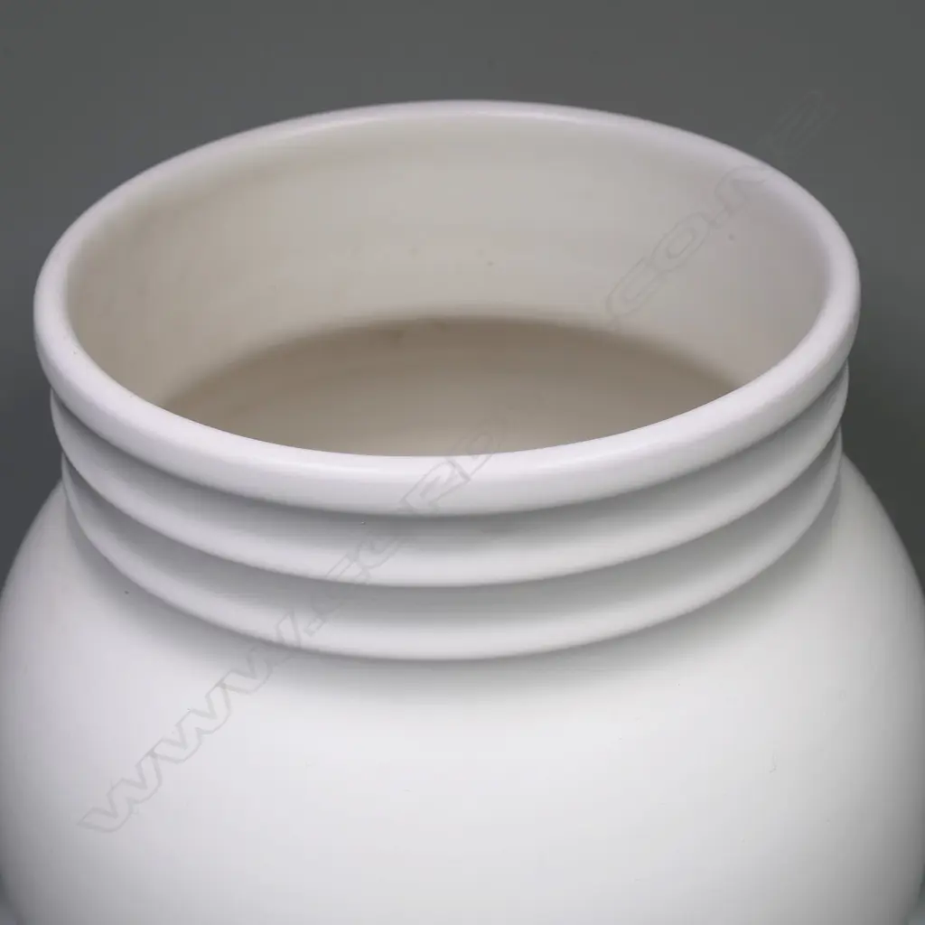 Crown Lynn Shufflebotham hand potted white vase. Baluster shape with lathed cut bands top and bottom. Stamped Hand Crafted by Crown Lynn and incised #57 to base. H.250mm Image 1++
