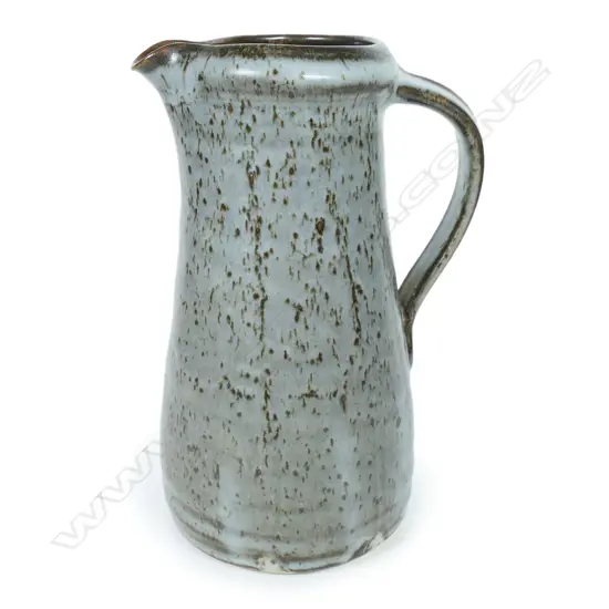 Len Castle jug of tapered cylinder form with variable dark grey glaze. Impressed mark. H.245mm
