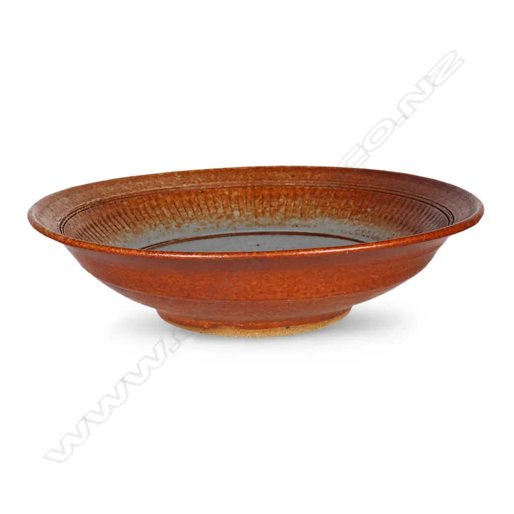 Len Castle shino glazed shallow bowl with repeating pattern below the rim, Image 1++