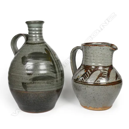 Peter Stichbury Pottery wine bottle and jug brushed iron glaze decoration on grey ground. H.250mm & 185mm. c.1970's.
