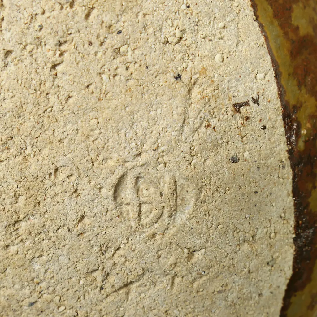 Don Thornley dish decorated with impressed stamp designs, wood ash glaze in green and brown tones. Makers mark stamped to base. 295 x 290 x 70mm. Image 1++