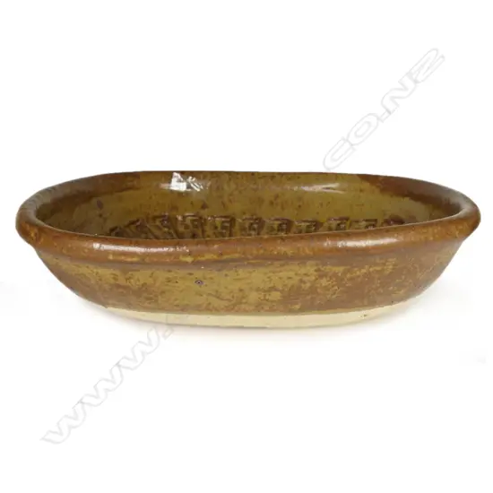 Don Thornley dish decorated with impressed stamp designs, wood ash glaze in green and brown tones. Makers mark stamped to base. 295 x 290 x 70mm.