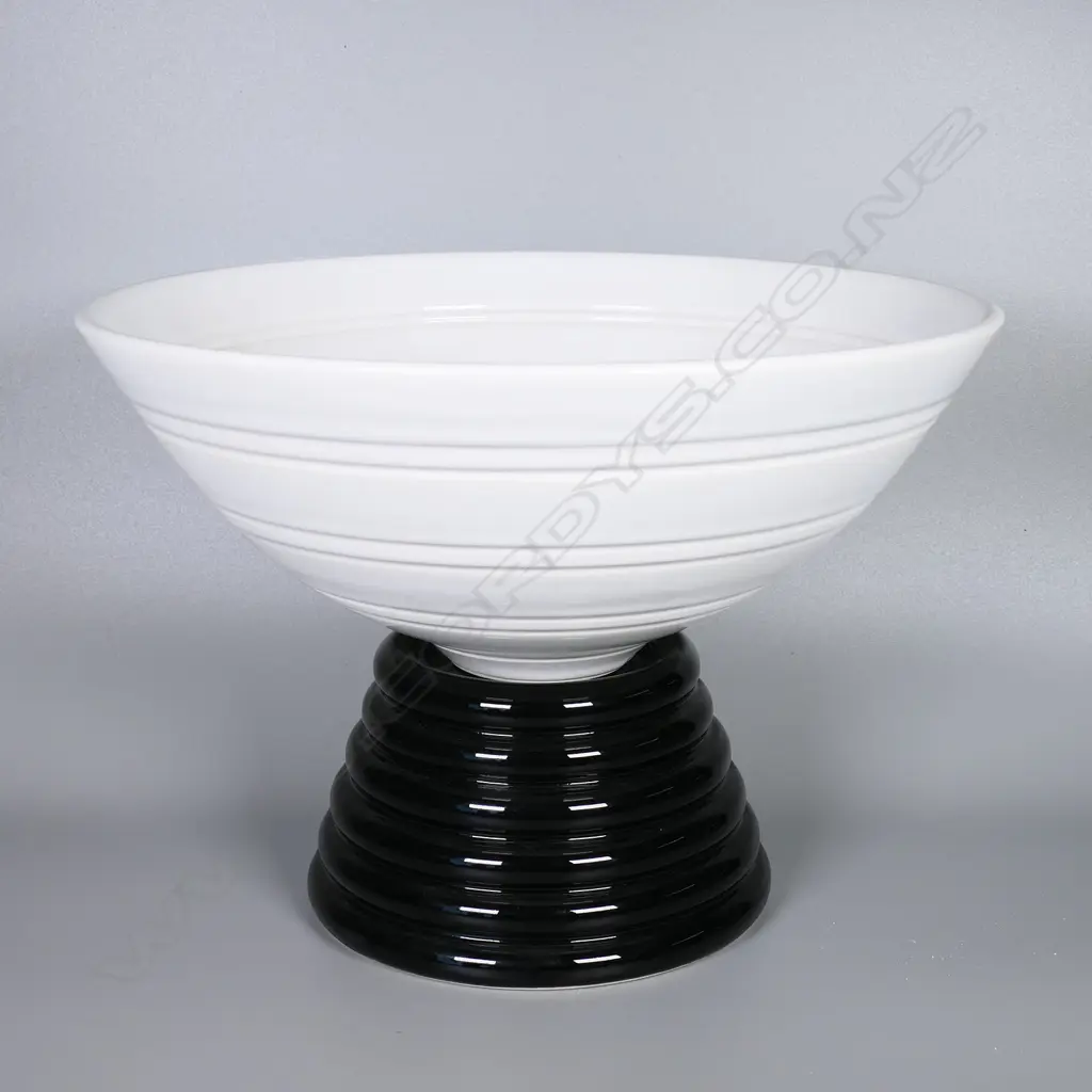 John Parker ribbed white porcelain bowl on a tiered black porcelain stand. Dia.270mm H.200mm with stand. Artist's name and VIII stamped to base Image 1++