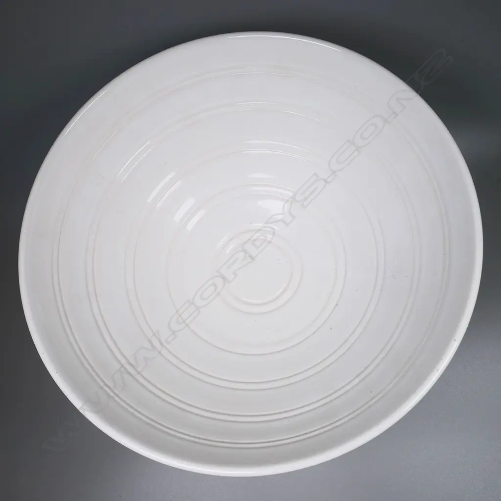 John Parker ribbed white porcelain bowl on a tiered black porcelain stand. Dia.270mm H.200mm with stand. Artist's name and VIII stamped to base Image 1++