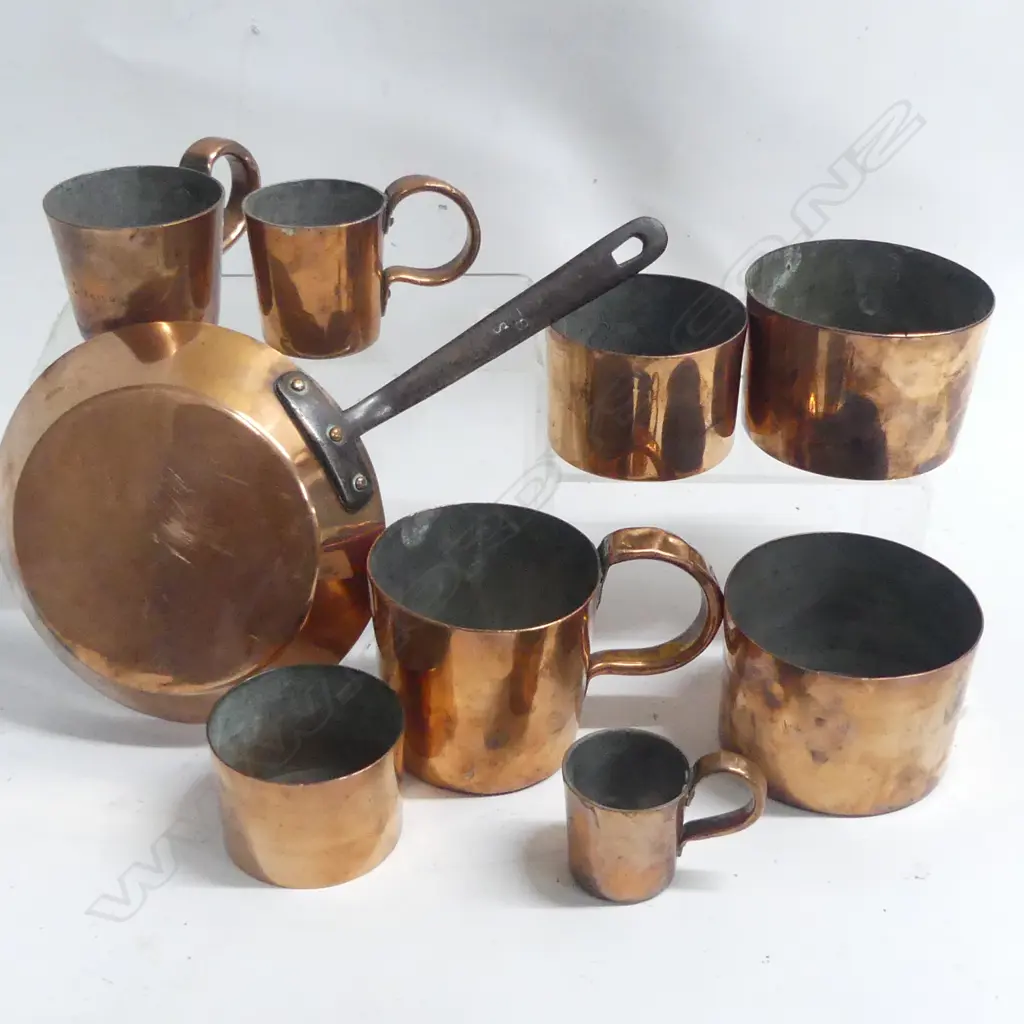 Set of four 19thC copper jugs, four small cylindrical basins and a small copper frying pan. Image 1++