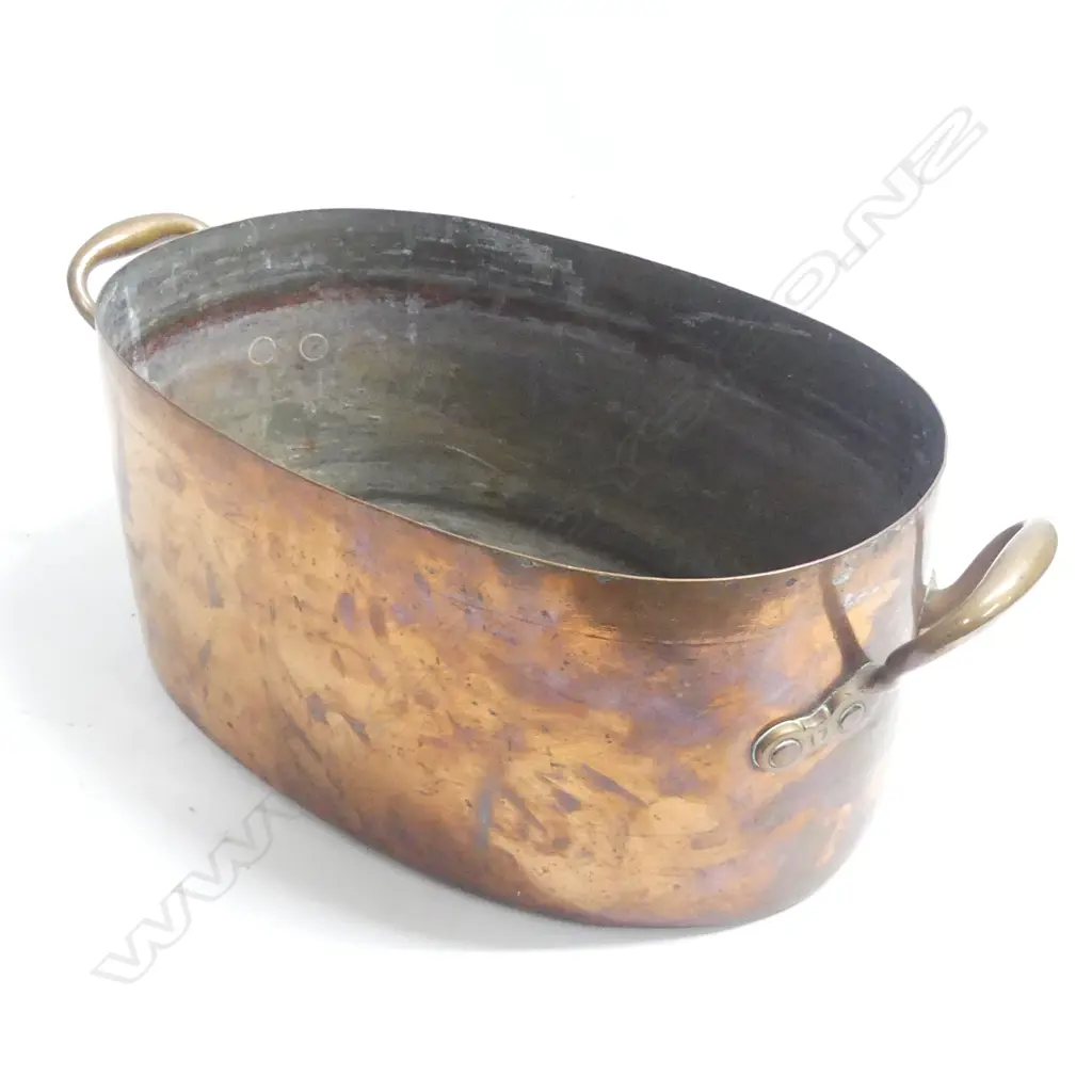 A large oval copper two handled pan. W.540mm across handles. Image 1++