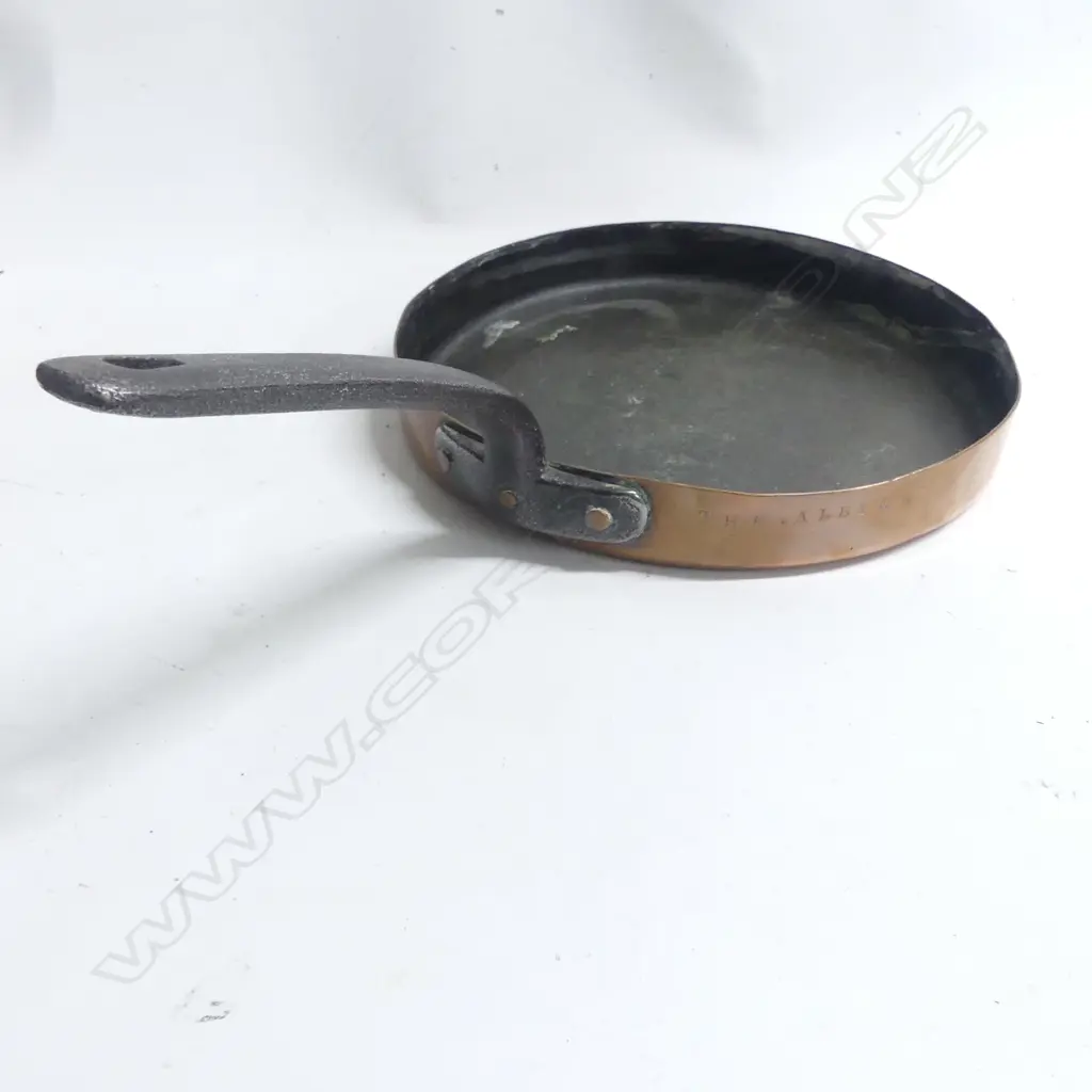 A 19thC copper frying pan with iron handle. Dia.285mm. Stamped to the rim 'The Albion' Image 1++