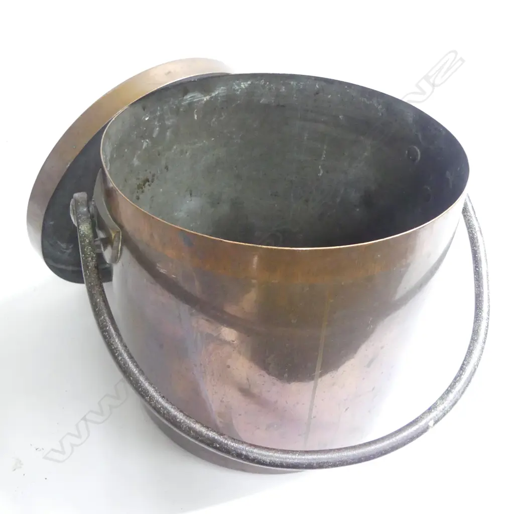 A very large 19thC copper kitchen pot, cylindrical with fitted lid and steel swing handle, of approximately 27 gallon capacity,  the lid with loop handle stamped '14'. Dia.355, H.350mm. Image 1++