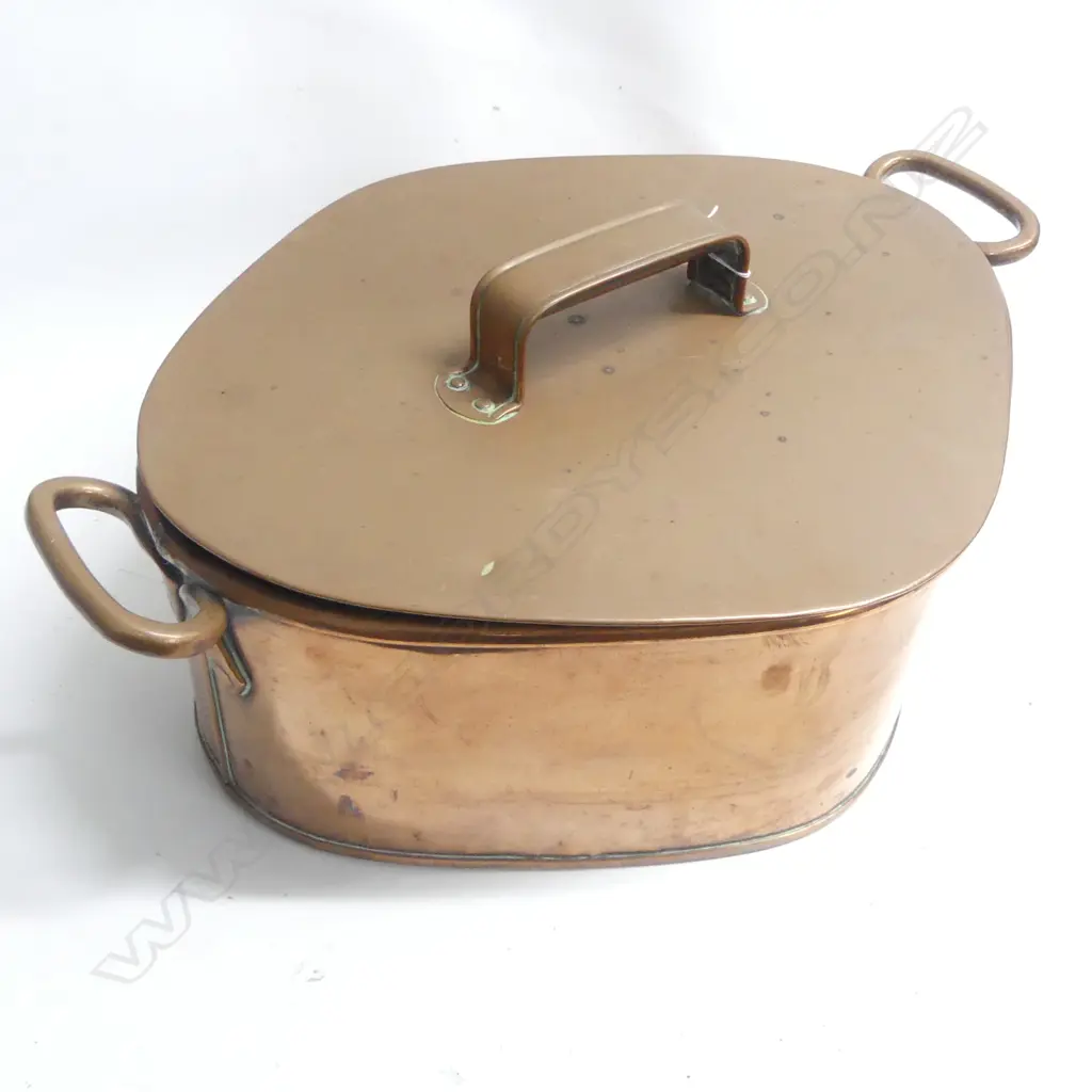 A Victorian copper Turbot pan of rhombus shape to accept the fish with two loop handles to the rim and lid with riveted handle. W.550mm across handles. Image 1++