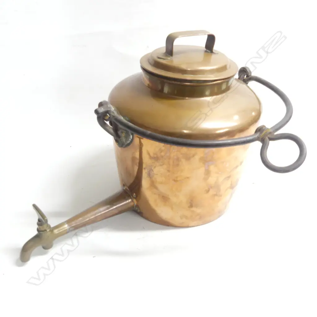 A large 19thC copper kettle with wrought iron swing handle handle and long spigot tap. Image 1++