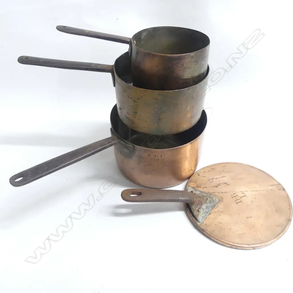Three Victorian copper cooking pots graduated sizes one with fitted lid plain cylindrical bodies with riveted iron handles.  Dia.210. 185 and 145mm. Image 1++