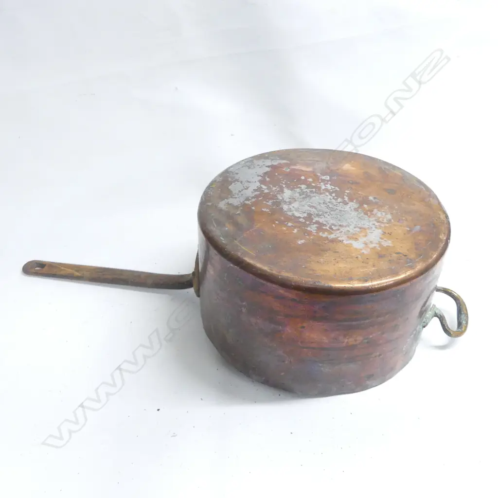 A large Victorian copper 30 pint cooking pot, cylinderical body with long riveted iron handle. Dia.330mm. Image 1++