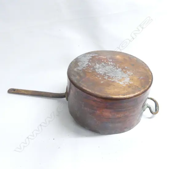 A large Victorian copper 30 pint cooking pot, cylinderical body with long riveted iron handle. Dia.330mm.