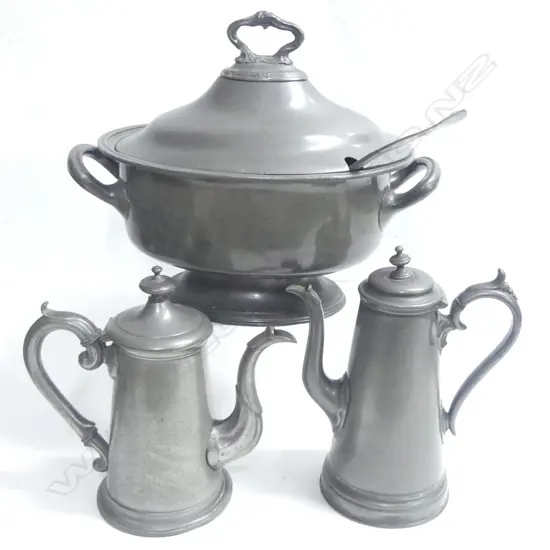 A Victorian pewter two-handled oval soup tureen, L.370mm, together with a fiddle pattern ladle; along with two early pewter coffee pots with tapered cylindrical bodies, scroll handles, the domed lids with knob finials. H.255 and 240mm.