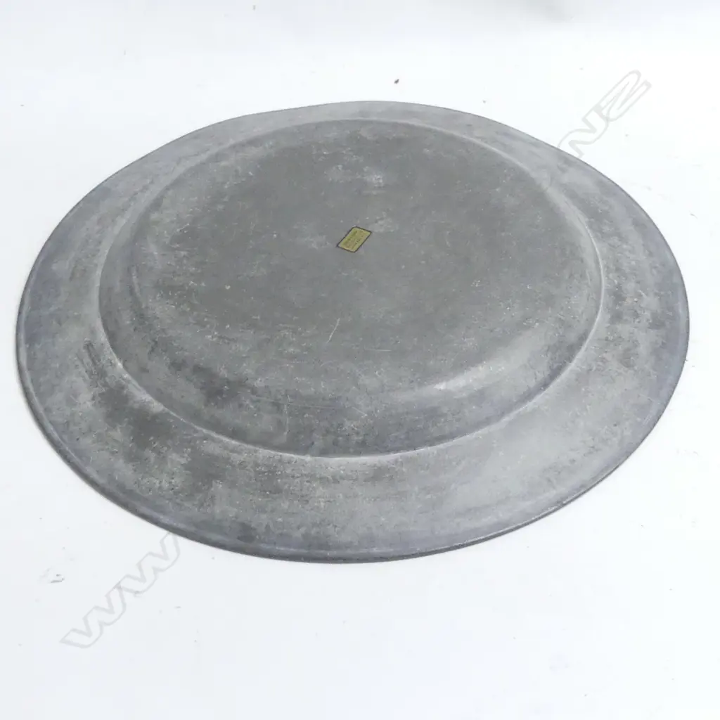 A very large 18thC pewter charger- the broad rim stamped with three initials- bears ‘David Cooke’ label to the back. Dia.460mm. Image 1++