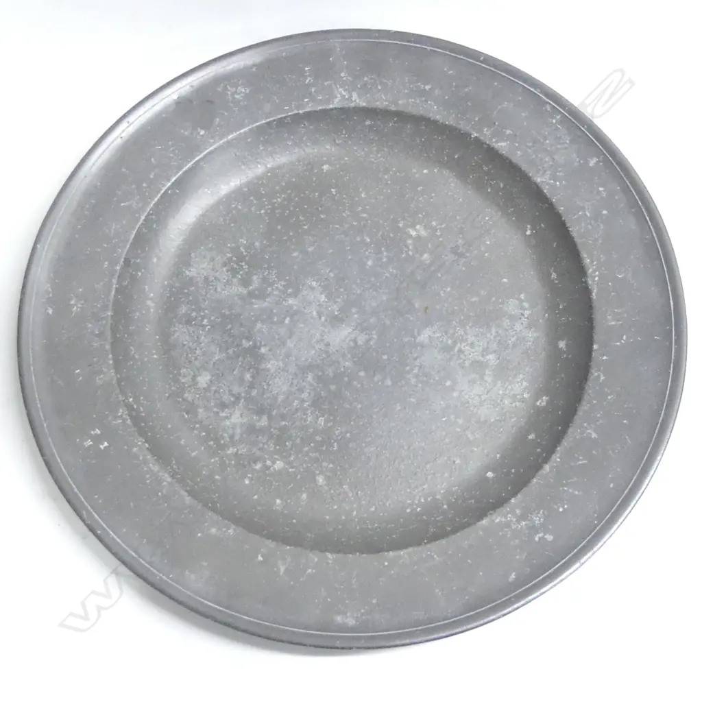 A very large 18thC pewter charger- the broad rim stamped with three initials- bears ‘David Cooke’ label to the back. Dia.460mm. Image 1++