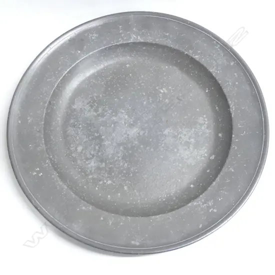 A very large 18thC pewter charger- the broad rim stamped with three initials- bears ‘David Cooke’ label to the back. Dia.460mm.