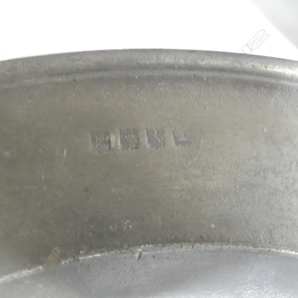A large Georgian period pewter charger. Dia.420mm; three Georgian chargers.  Dia.380mm; a large Georgian plate. Dia.300mm- and two European pewter serving spoons with turned wooden handles, Image 1++