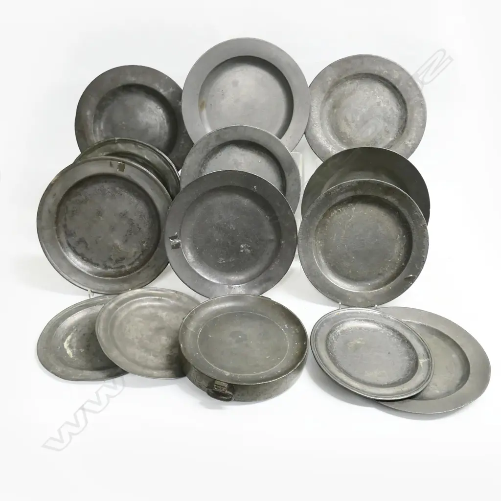 Thirteen Georgian period pewter plates of plain design with wide flat rims- approx Dia.230mm; together with a water-jacketed warming plate with London touch marks Image 1++
