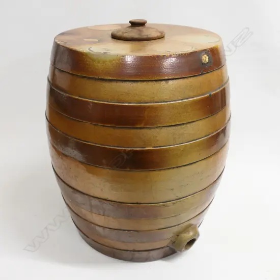 A large tan stoneware barrel with moulded rings. H.420mm