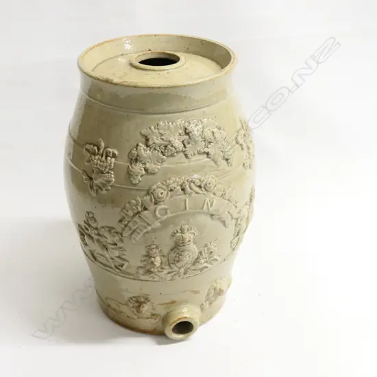 A Victorian salt glazed 'Gin' barrel with British coat of arms and 'GIN' to a ribbon framed by armoured knights on horseback, other relief grape leaf and lions head design. H.355mm