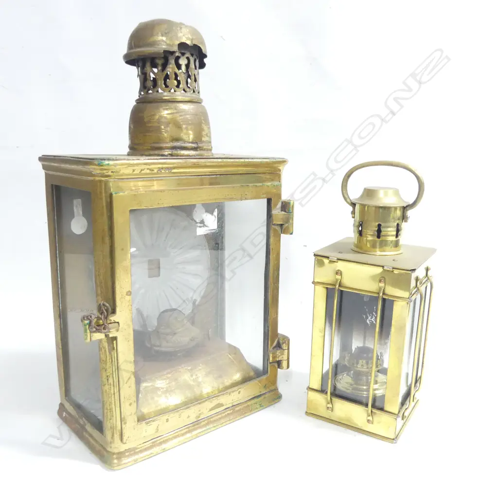 A large brass lantern, ex Waitara Wharf; and a replica smaller brass lantern. Image 1++