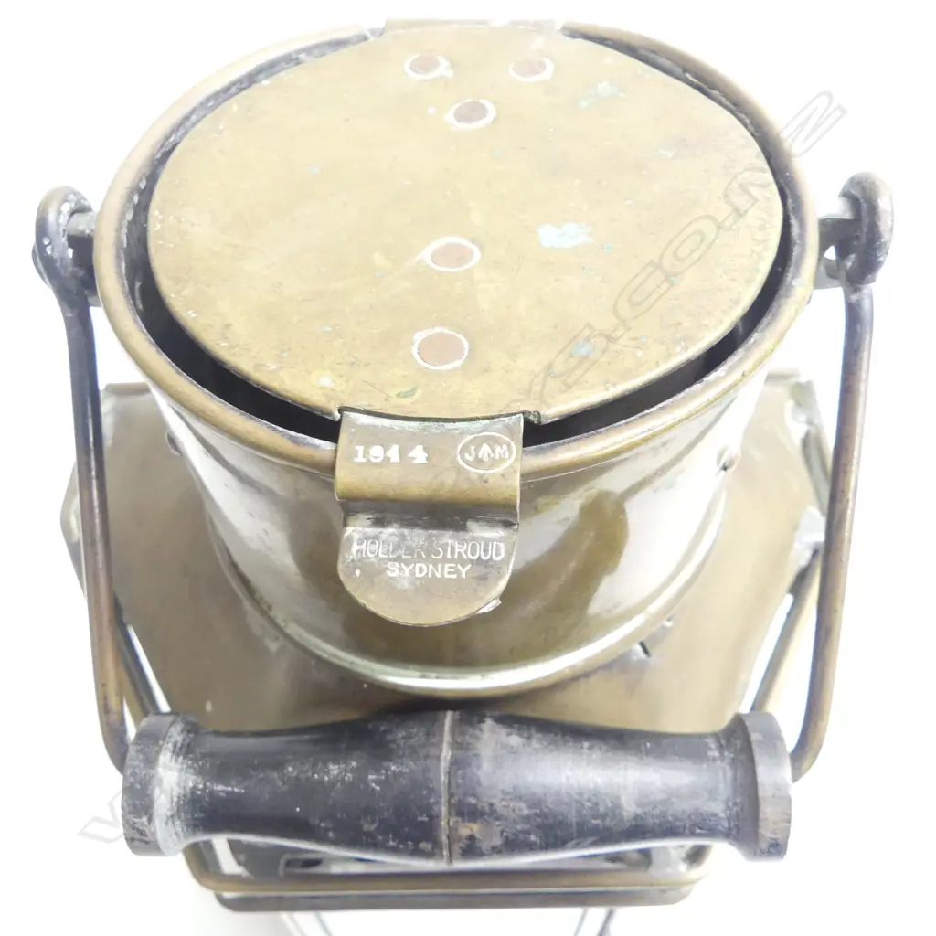 An old brass ship's companionway lamp with turned wood swing handle by Holder & Stroud. Sydney. 1944. H.410mm Image 1++