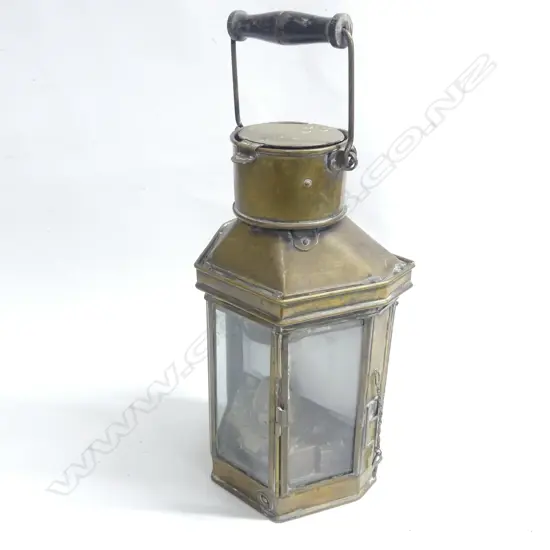 An old brass ship's companionway lamp with turned wood swing handle by Holder & Stroud. Sydney. 1944. H.410mm