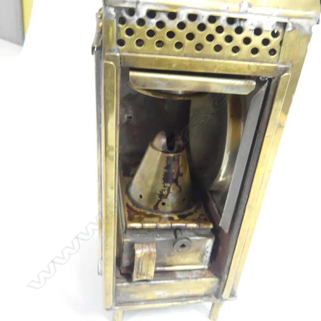 A brass ships' companionway or watch lantern by Eli Griffiths & Sons. 1915 (Birmingham) housing the original oil burner and reflector to the interior. H.335mm. Image 1++