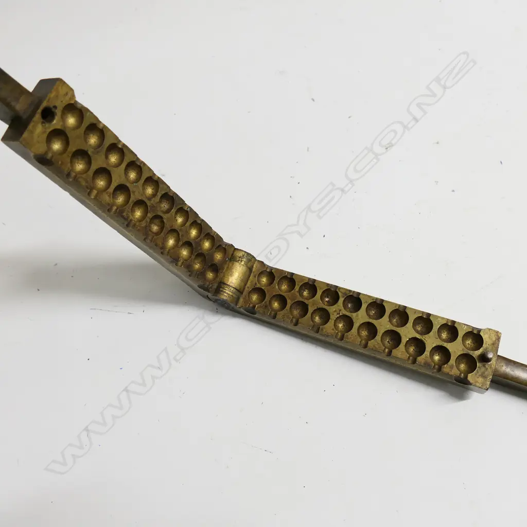 A large brass gang mould for casting 20 round ball bullets. Image 1++