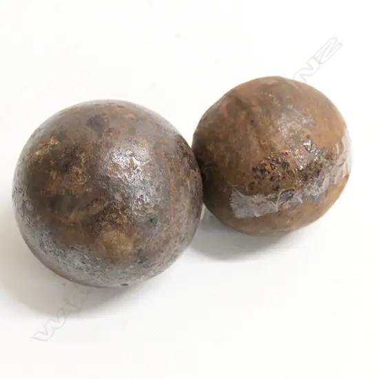 Two cannon balls, one approx 3½" diameter, the other slightly smaller