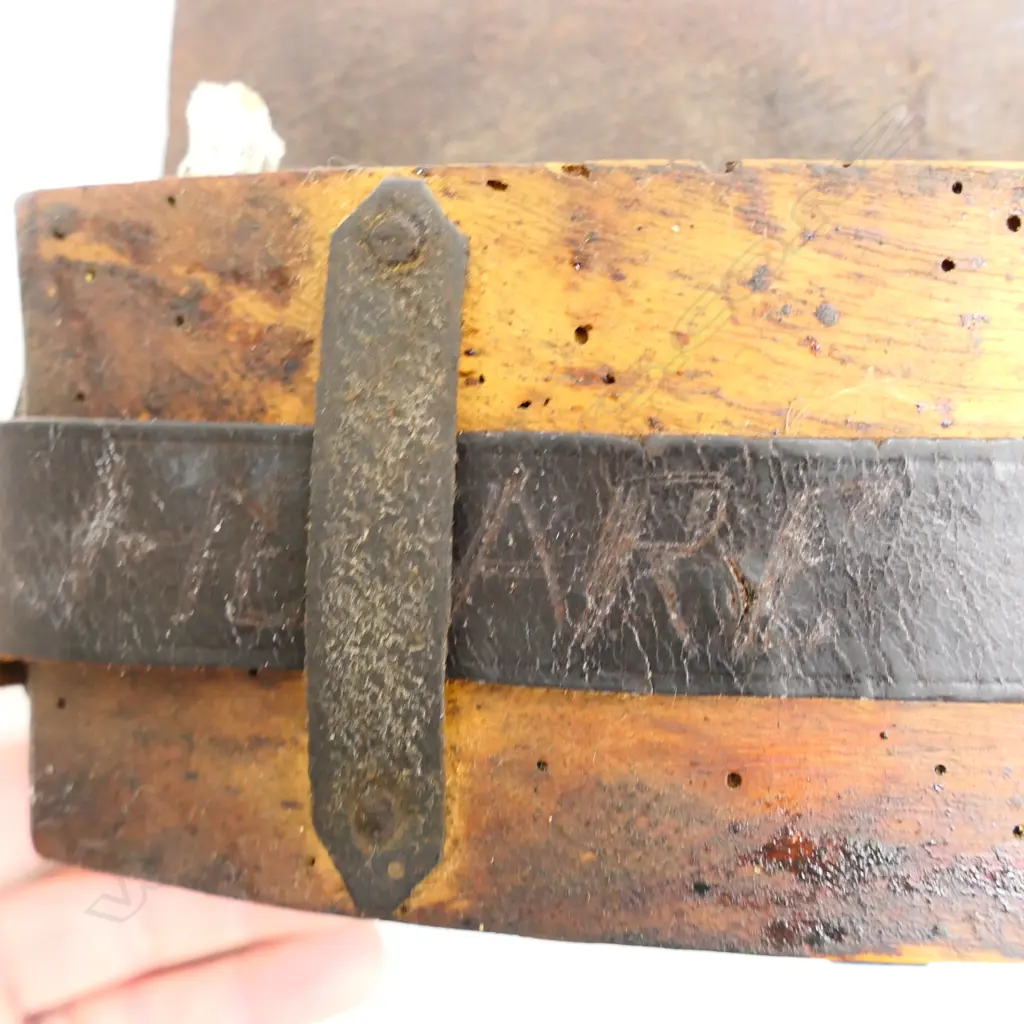 A leather bound ammunition pouch. Possibly used in the New Zealand Wars,  'Henare' etched into belt. Image 1++