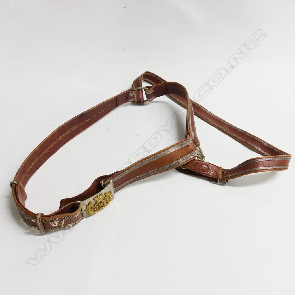 A Victorian Colonial officers sword belt, c.1866, brown leather with bullion trim and VR cypher buckle. Image 1++