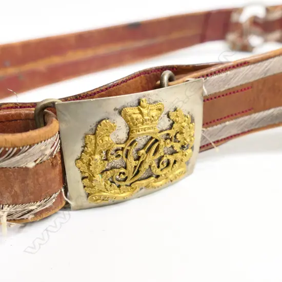 A Victorian Colonial officers sword belt, c.1866, brown leather with bullion trim and VR cypher buckle.