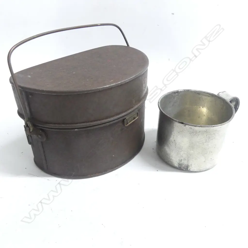 A scarce 1868-74 pattern military mess tin and military type tin cup; the tin complete with swing handle, fitted interior, ring fittings, surface rust but sound condition. Image 1++