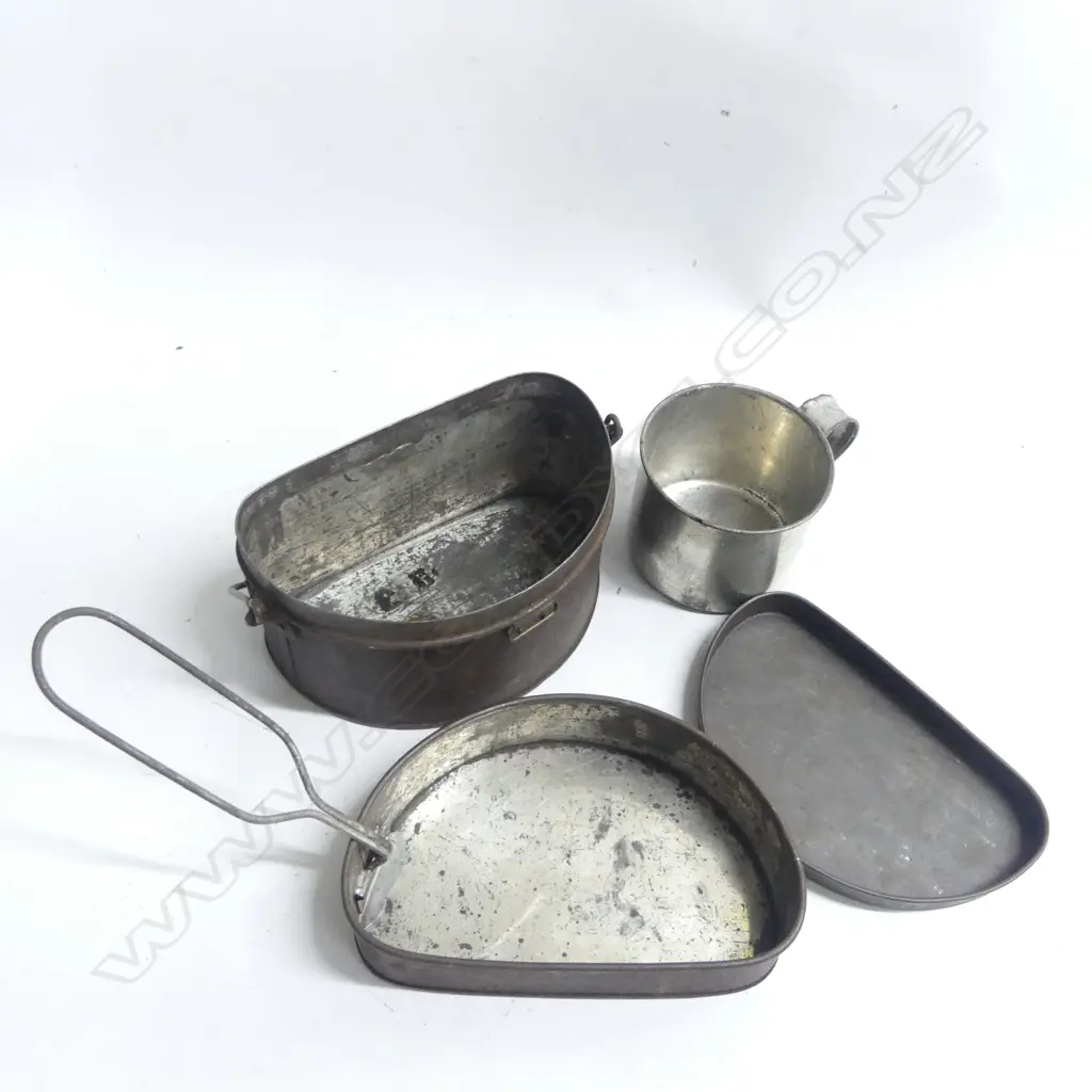 A scarce 1868-74 pattern military mess tin and military type tin cup; the tin complete with swing handle, fitted interior, ring fittings, surface rust but sound condition. Image 1++