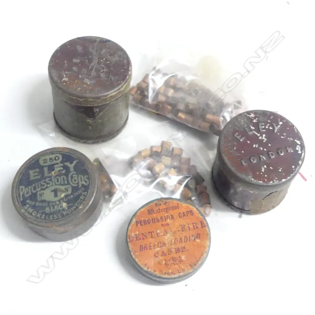 Four small vintage tins for percussion caps, all variously marked Eley, London, along with a selection of caps Image 1++