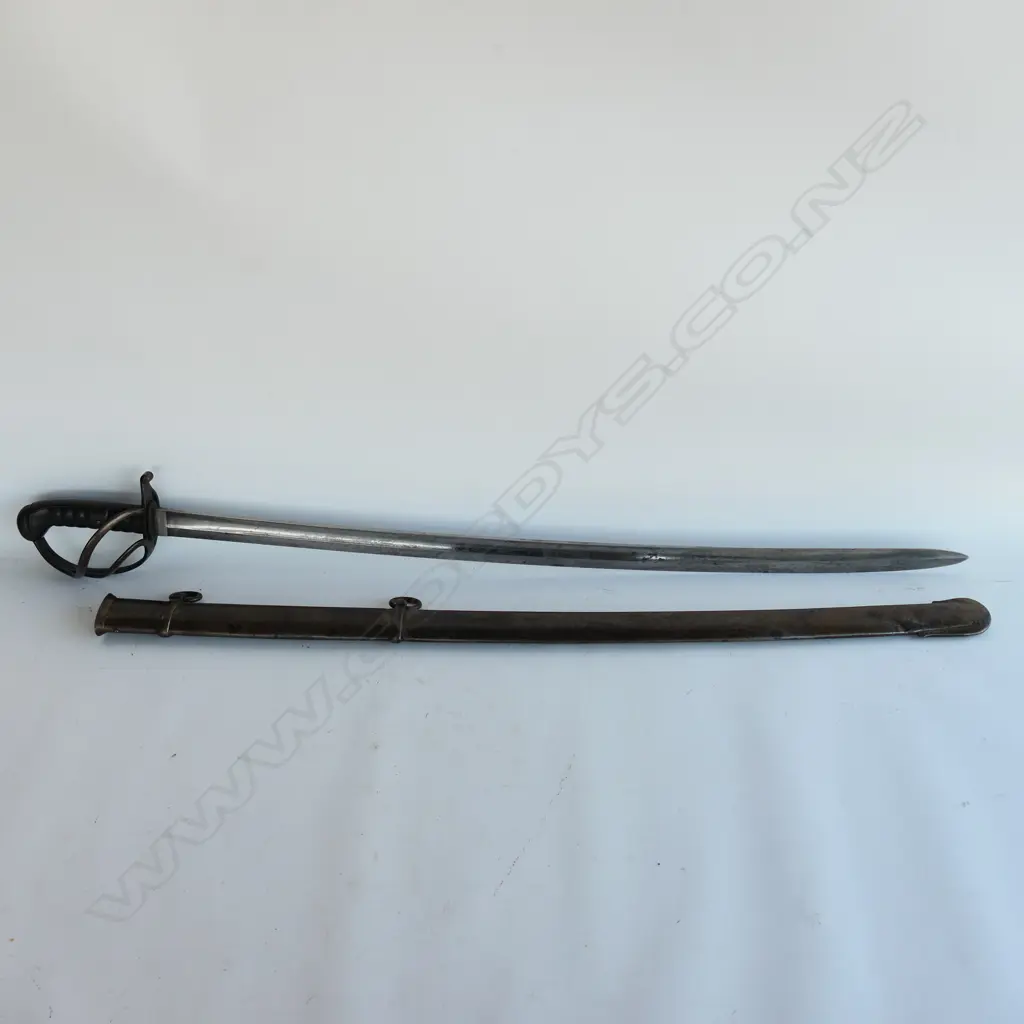 A Light Cavalry Trooper's sabre and steel scabbard,1821 pattern, with 890mm slightly curved, spear pointed, wide single fullered blade, double edged 270mm from point. Image 1++