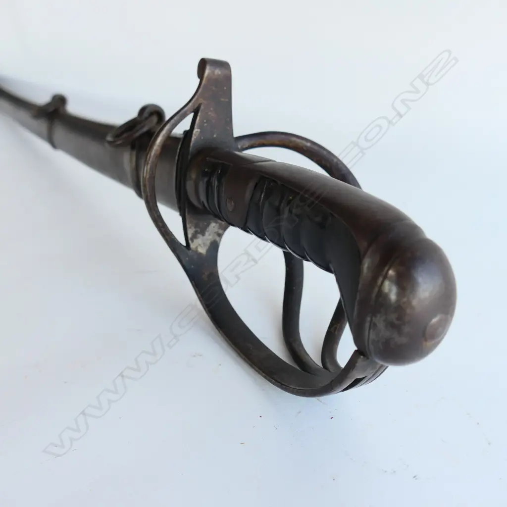 A Light Cavalry Trooper's sabre and steel scabbard,1821 pattern, with 890mm slightly curved, spear pointed, wide single fullered blade, double edged 270mm from point. Image 1++