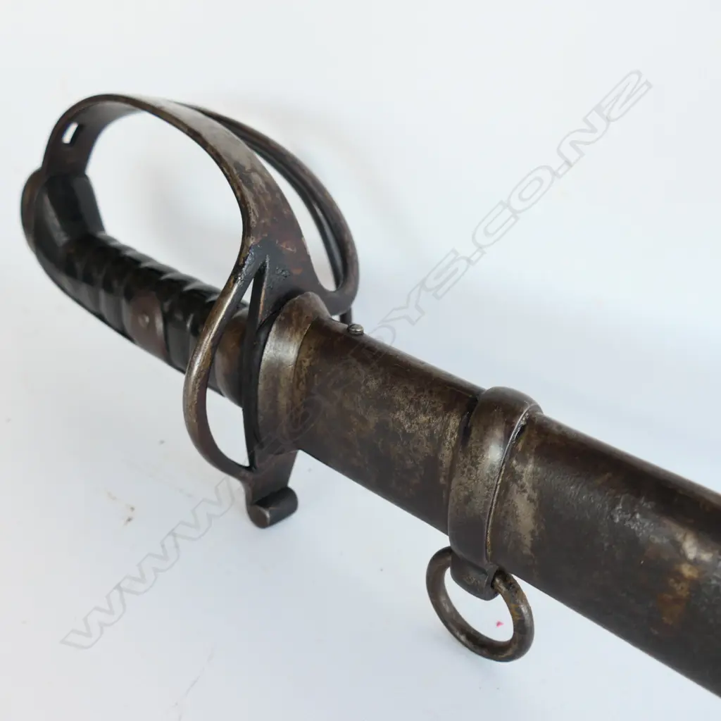 A Light Cavalry Trooper's sabre and steel scabbard,1821 pattern, with 890mm slightly curved, spear pointed, wide single fullered blade, double edged 270mm from point. Image 1++