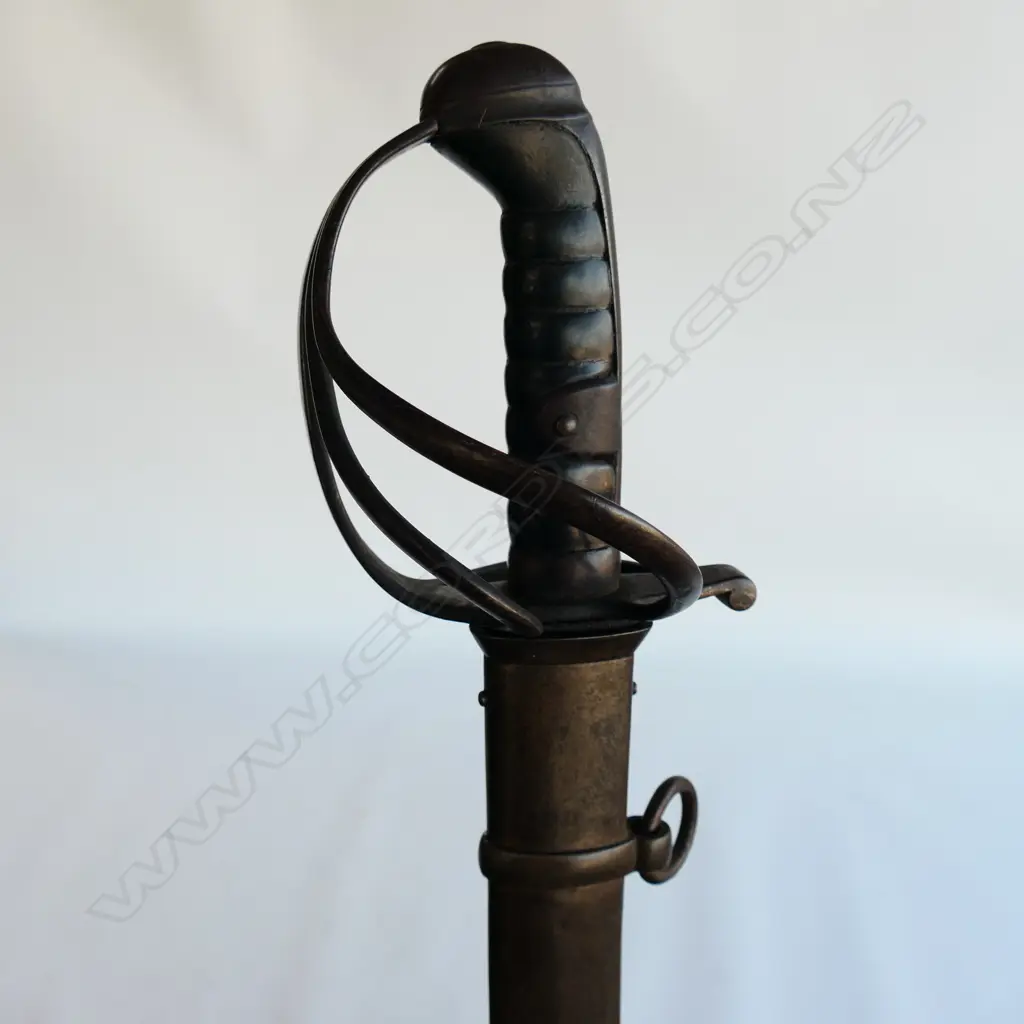 A Light Cavalry Trooper's sabre and steel scabbard,1821 pattern, with 890mm slightly curved, spear pointed, wide single fullered blade, double edged 270mm from point. Image 1++