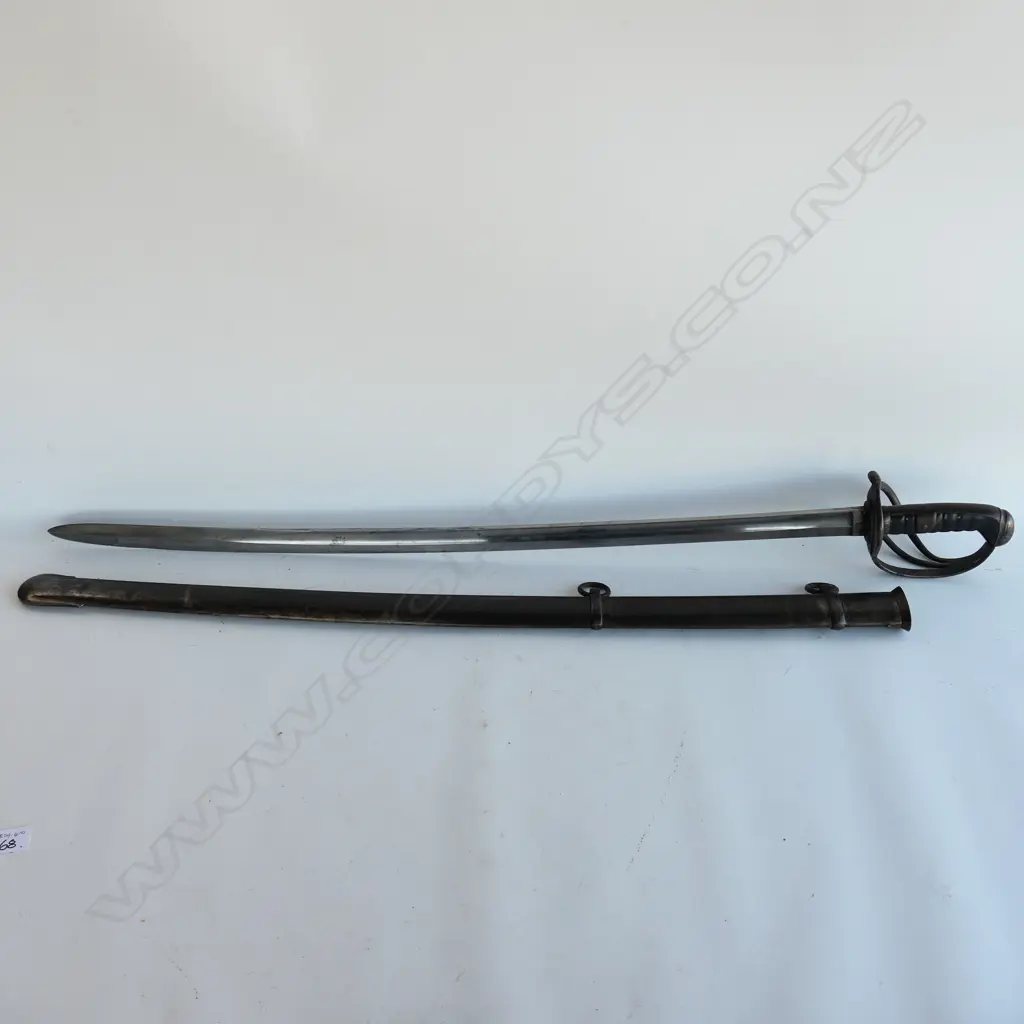 A Light Cavalry Trooper's sabre and steel scabbard,1821 pattern, with 890mm slightly curved, spear pointed, wide single fullered blade, double edged 270mm from point. Image 1++