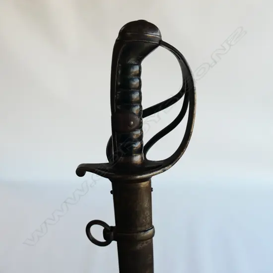A Light Cavalry Trooper's sabre and steel scabbard,1821 pattern, with 890mm slightly curved, spear pointed, wide single fullered blade, double edged 270mm from point.