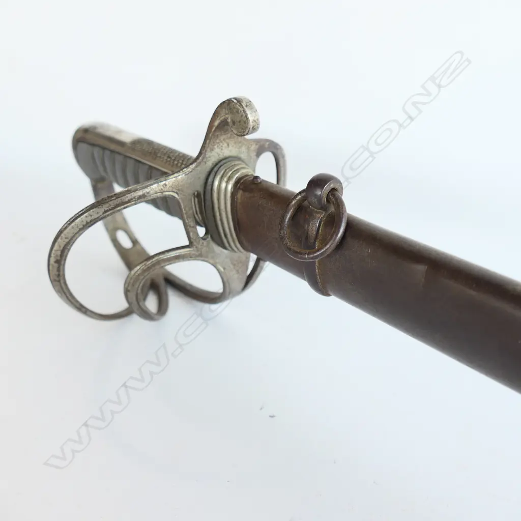 An 1821 pattern Royal Artillery Officer's sword with steel scabbard, the nickel plated 'three bar' hilt with open swept guard and sharkskin wire bound grip. Image 1++