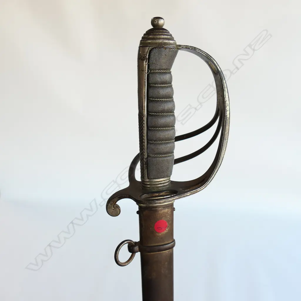 An 1821 pattern Royal Artillery Officer's sword with steel scabbard, the nickel plated 'three bar' hilt with open swept guard and sharkskin wire bound grip. Image 1++