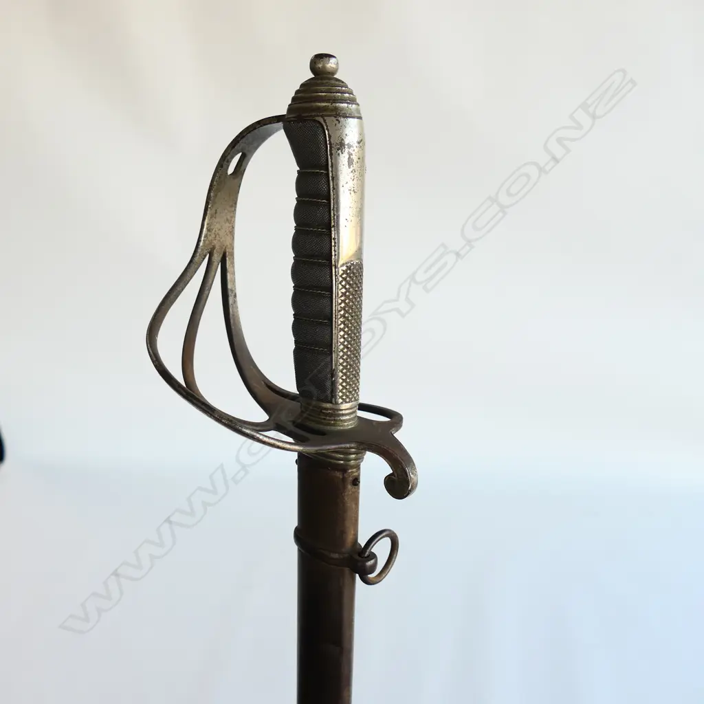 An 1821 pattern Royal Artillery Officer's sword with steel scabbard, the nickel plated 'three bar' hilt with open swept guard and sharkskin wire bound grip. Image 1++