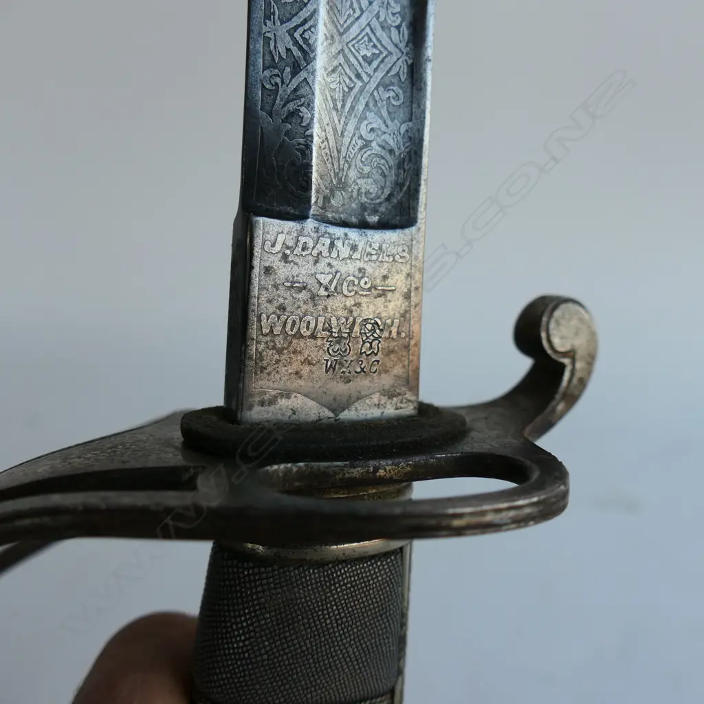 An 1821 pattern Royal Artillery Officer's sword with steel scabbard, the nickel plated 'three bar' hilt with open swept guard and sharkskin wire bound grip. Image 1++