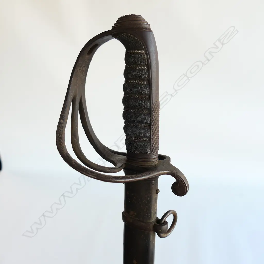 An 1821 Pattern Royal Artillery Officer's sword with steel scabbard, the 'three bar' hilt with open swept guard and sharkskin wire bound grip. Image 1++