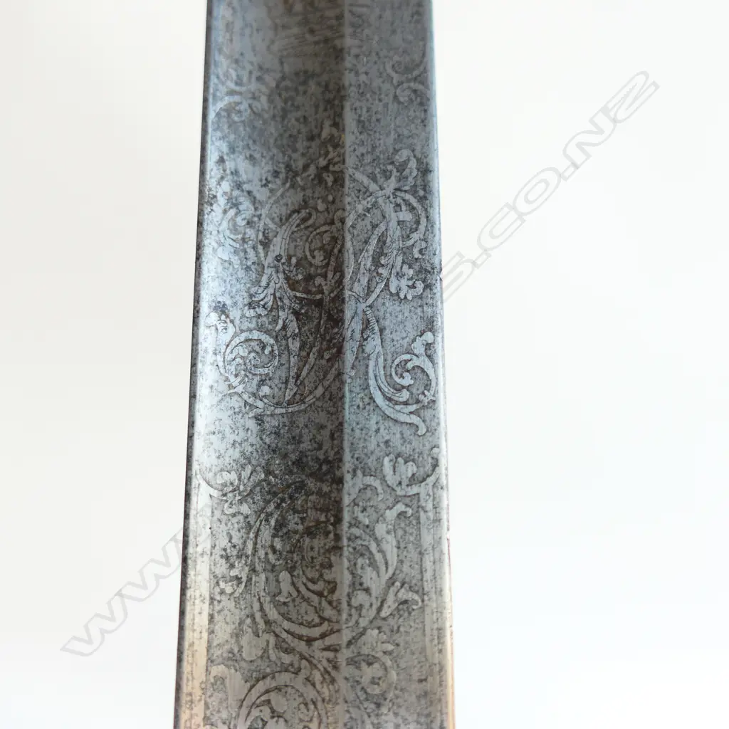 An 1821 Pattern Royal Artillery Officer's sword with steel scabbard, the 'three bar' hilt with open swept guard and sharkskin wire bound grip. Image 1++
